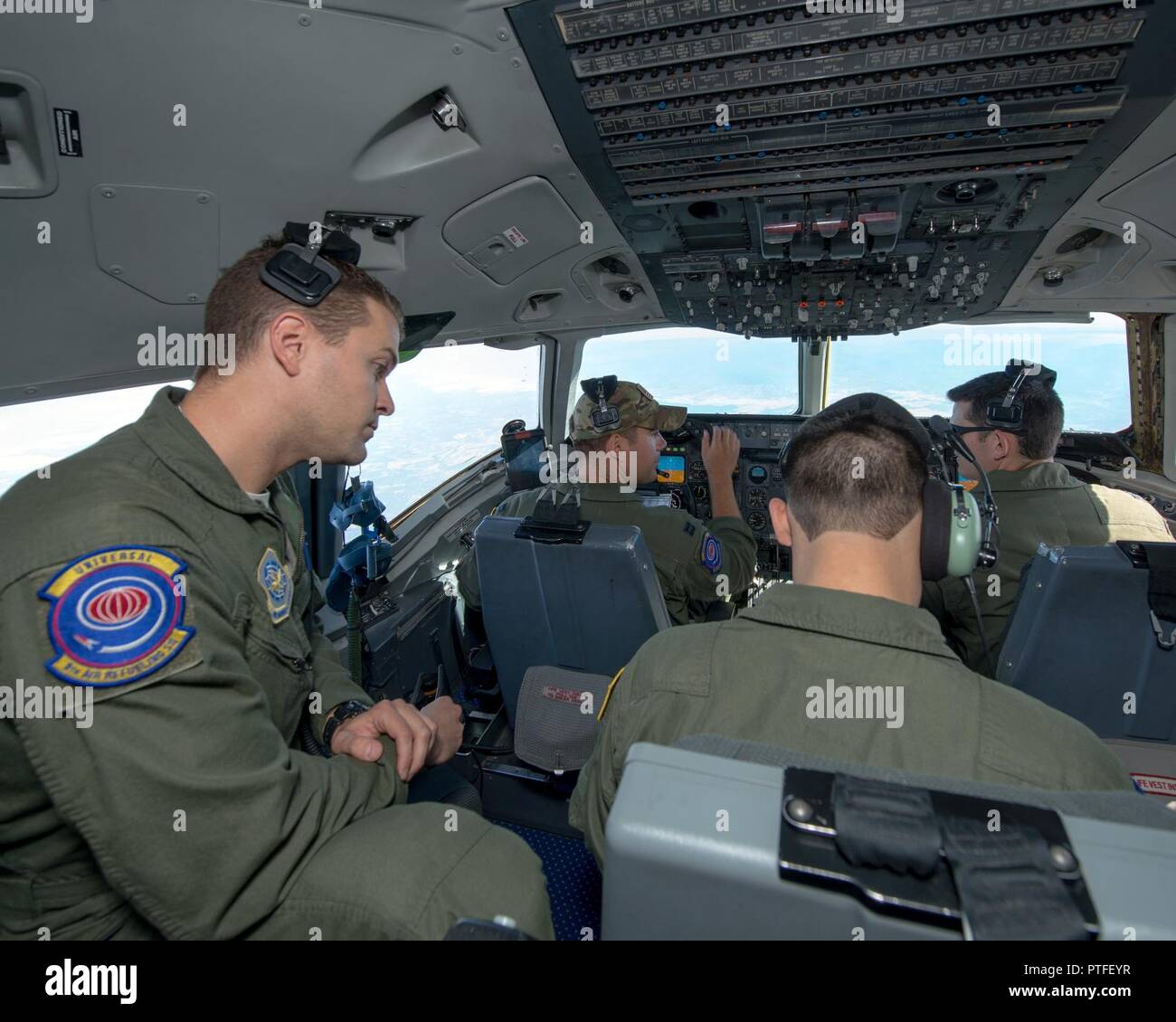 Aircrew members from the 9th Air Refueling Squadron, Travis Air Force Base, Calif., fly a training mission in Northern Calif., July 20, 2017. Part of the mission included an air refueling of a C-17 Globemaster III from the 301st Airlift Squadron, 349th Air Mobility Wing. Stock Photo