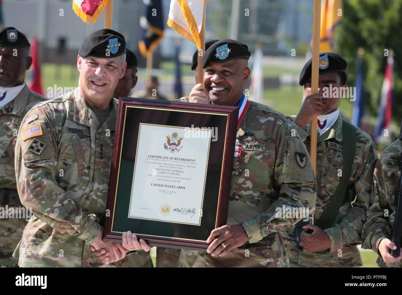 U.S. Army Gen. Gus Perna, Army Materiel Command commander, presents Lt.  Gen. Larry Wyche, AMC deputy commanding general, with his retirement  certificate July 21, 2017 at Redstone Arsenal, Alabama. Wyche is officially, image size:1300x956