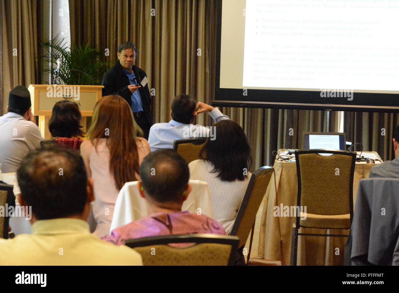 Col. Francis Cabugon, executive officer for the Armed Forces of the Philippines, gives a presentation during the Health Emergencies in Large Populations (H.E.L.P.) course at the Hale Koa Hotel in Honolulu, Hawaii, July 17. Stock Photo