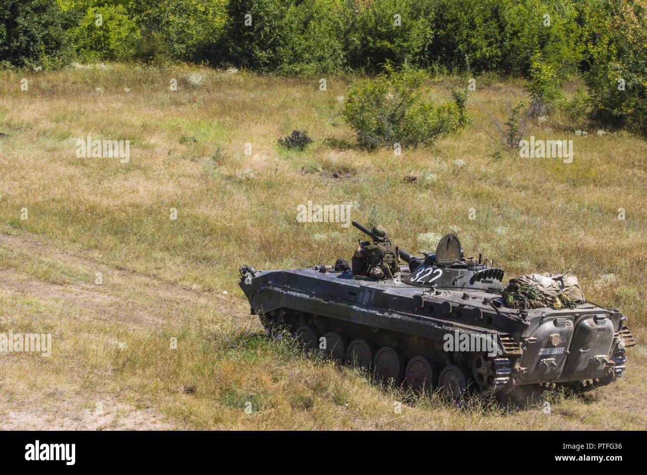 A Bulgarian Land Forces tank moves to an objective during a combined arms live fire exercise titled Peace Sentinel  at Koren, Bulgaria, on July 19. Exercise Saber Guardian 17 is a U.S. European Command, U.S. Army Europe-led exercise in the Black Sea Region that builds readiness and improves interoperability among the 20 Allies who participate. Stock Photo