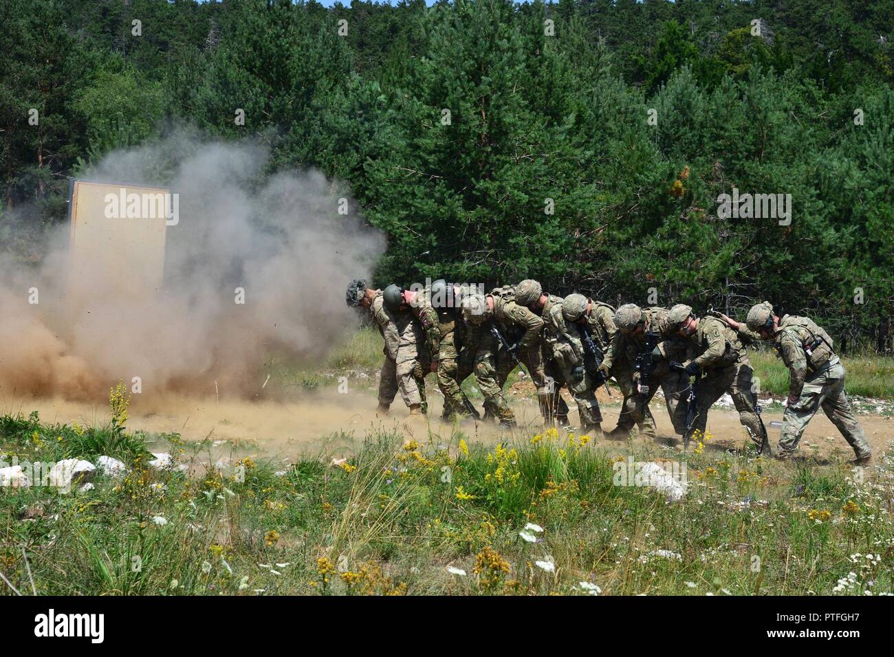 U.S. Army Paratroopers assigned to 54th Brigade Engineer Battalion, 173rd Airborne Brigade, and Slovenian Armed Forces conduct urban breach training  as part of Exercise Rock Knight at Pocek Range in Postonja, Slovenia, July 20, 2017. Exercise Rock Knight is a bilateral training exercise between the U.S. Army 173rd Airborne Brigade and the Slovenian Armed Forces, focused on small-unit tactics and building on previous lessons learned, forging the bonds and enhancing readiness between allied forces. The 173rd Airborne Brigade is the U.S. Army's Contingency Response Force in Europe, providing rap Stock Photo