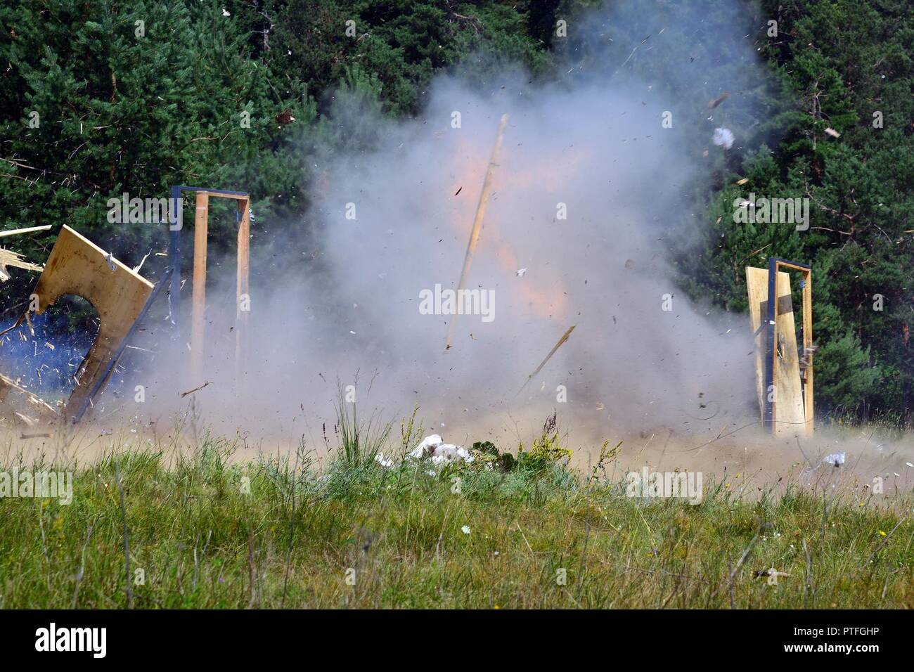 U.S. Army Paratroopers assigned to 54th Brigade Engineer Battalion, 173rd Airborne Brigade, detonate explosives during the urban breaching training as part of Exercise Rock Knight at Pocek Range in Postonja, Slovenia, July 20, 2017. Exercise Rock Knight is a bilateral training exercise between the U.S. Army 173rd Airborne Brigade and the Slovenian Armed Forces, focused on small-unit tactics and building on previous lessons learned, forging the bonds and enhancing readiness between allied forces. The 173rd Airborne Brigade is the U.S. Army's Contingency Response Force in Europe, providing rapid Stock Photo