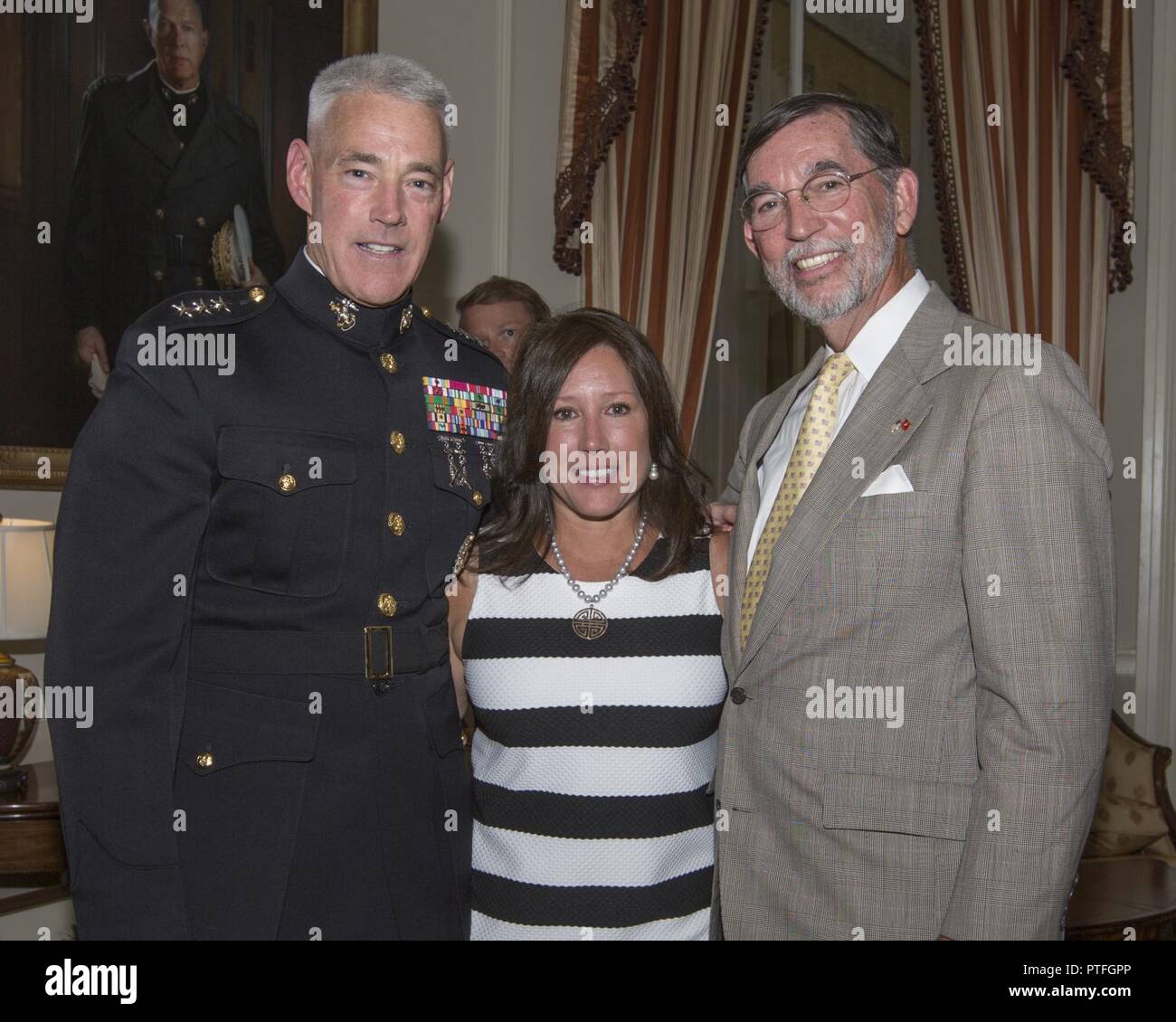 From left, Lt. Gen. Brian D. Beaudreault, Karen A. Beaudreault, and Peter J. Sweetser, pose for a photo, Marine Barracks Washington, Washington, D.C., July 21, 2017. Beaudreault was promoted to the rank of Lt. Gen. and will serve as the deputy commandant for Plans, Policies, and Operations. Stock Photo
