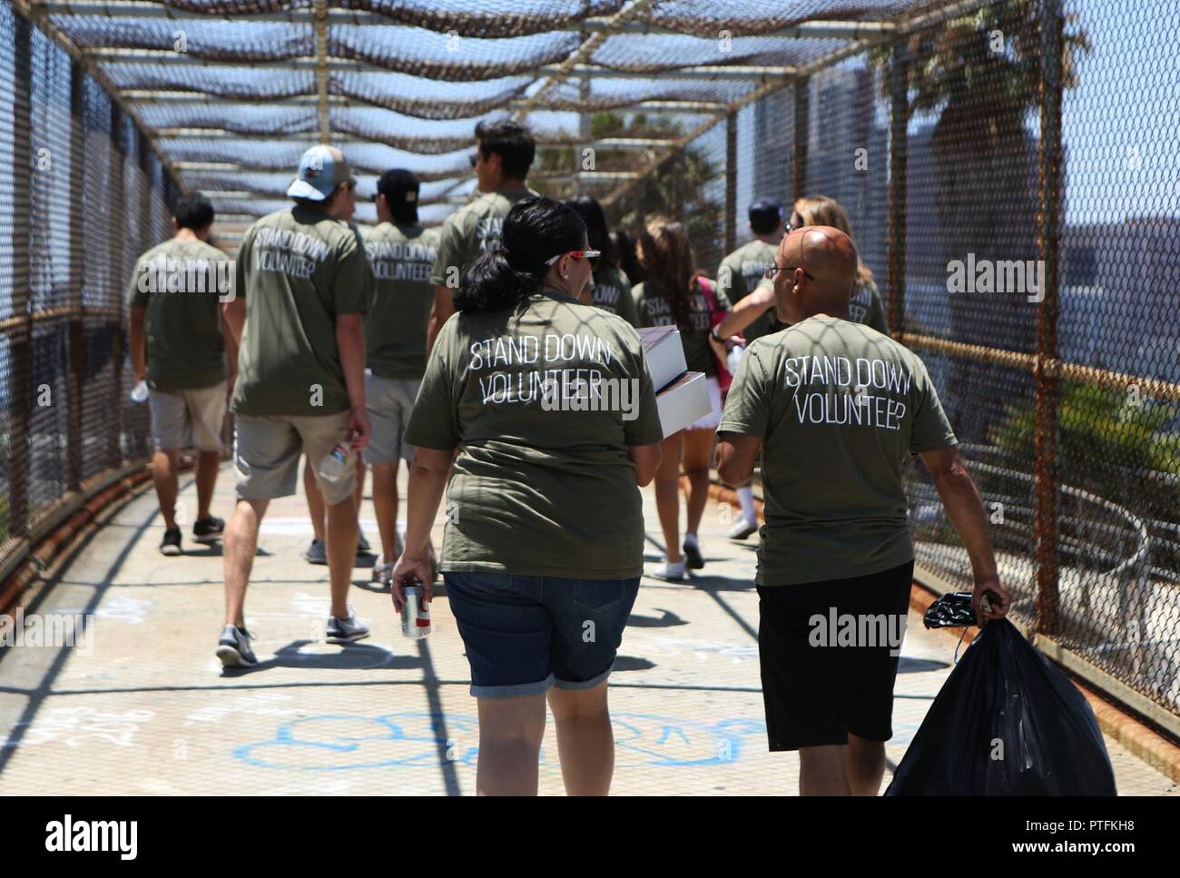 Volunteers with the Veterans Village of San Diego walk toward the 30th