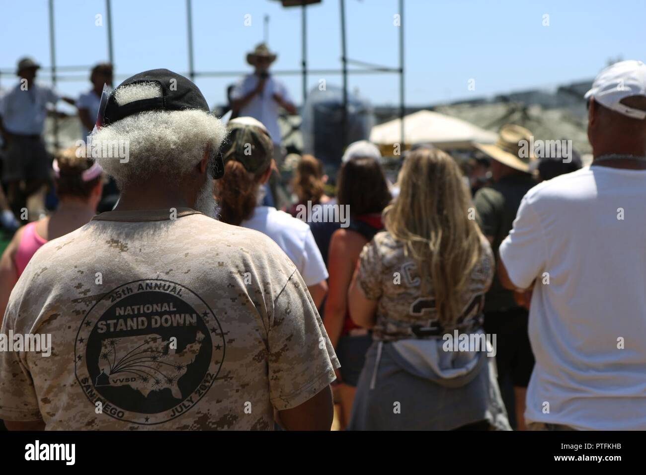 Veterans listen to a speech from Jon Nachison, cofounder of the