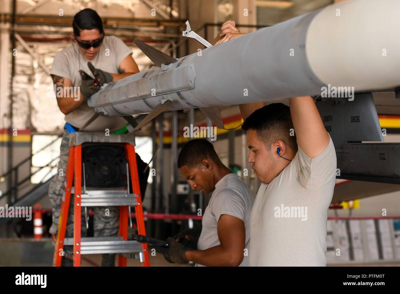 Load crew members assigned to the 421st Aircraft Maintenance Unit compete in a quarterly load competition, Hill Air Force Base, Utah, July 21, 2017. Stock Photo