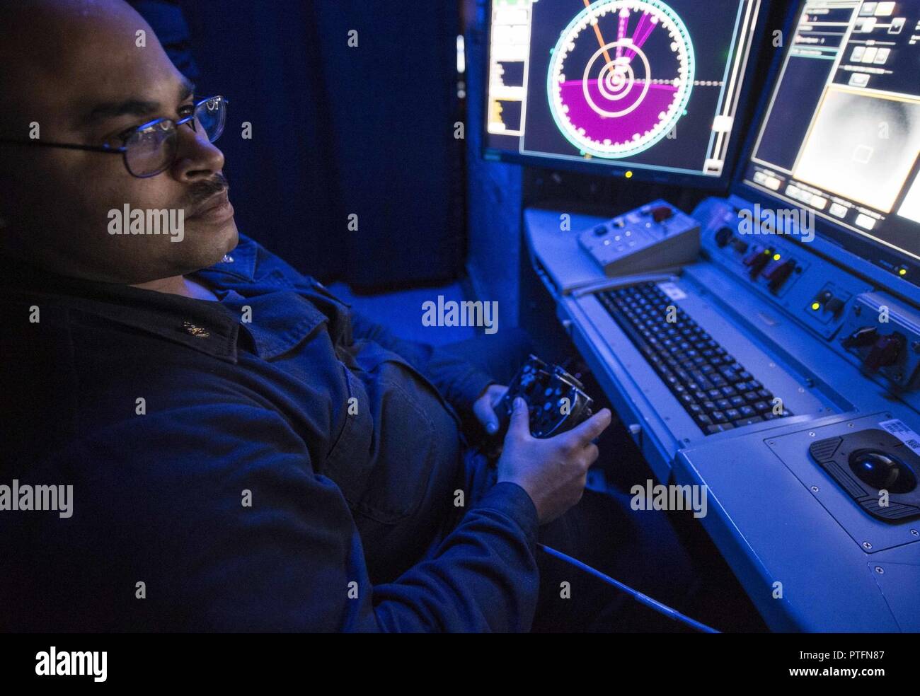 ARABIAN GULF (July 13, 2017) Chief Electronics Technician Travis Hill  operates the console of the Laser Weapon System (LaWS) aboard Afloat  Forward Staging Base (Interim) USS Ponce (AFSB(I) 15) to track a