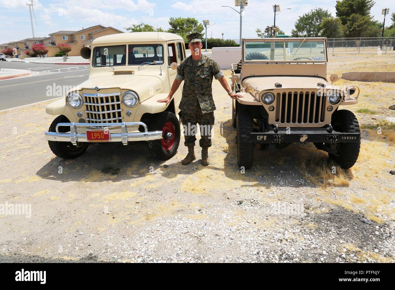 History buff and car enthusiast, Lt.Col. Timothy Silkowski, shows off his ‘40s era Ford Jeep and the 1950 Willys Station Wagon that he has restored over the course of his Marine Corps career. Both vehicles have identical, 134 cubic inch, 60 horsepower, 105 foot pounds of torque, 4 cylinder engines. The Willys-Overland Motor Company and Ford both produced Jeeps for World War II use with the station wagon rising out of a need to use up thousands of surplus engines once the war ended. Stock Photo