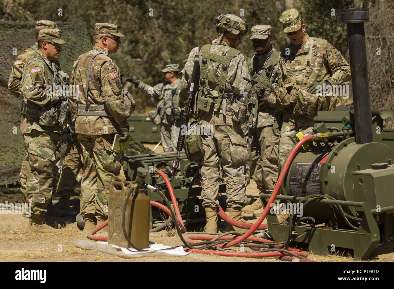 Maj. Gen. Todd McCaffrey, commanding general of First Army Division East, listens to soldiers assigned to 611th Quartermasters Company out of Baltimore, MD, as they explain the functions of a field shower system during Combat Support Training Exercise 91-17-03 July 20, 2017 on Fort Hunter Liggett, CA. CSTX is a 91st Training Division led exercise designed to assist combat-service and combat-service-support units in planning, preparing, supervising and executing of pre-mobilization collective training. Stock Photo