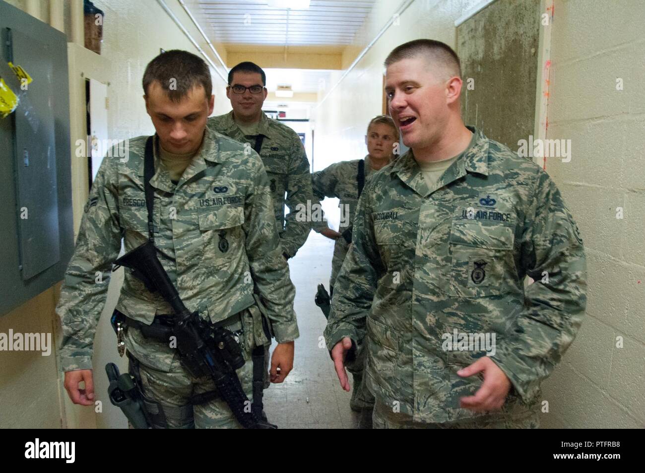 DAYTON, Ohio – Staff Sgt. Malcolm MacDougall, 88th Security Forces Squadron unit instructor (right), debriefs 88 SFS defenders on their performance after completing a room clearing walkthrough during annual training July 12. Students first complete walkthroughs of exercises before conducting live-fire demonstrations with simulation rounds. Stock Photo