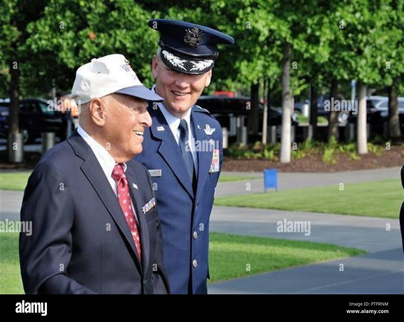 Maj. Gen. James A. Jacobson (right), Air Force District of Washington commander, walks beside World War II veteran, Lt. John Pedevillano, at the beginning of a Purple Heart award presentation ceremony July 14, 2017 at the U.S. Air Force Memorial, Arlington, Va. According to his family, even while injured, Pedevillano saved the lives of his badly-wounded waist gunners by securing their parachutes, pushing them out the side windows and pulling their cords. (Air Force Stock Photo