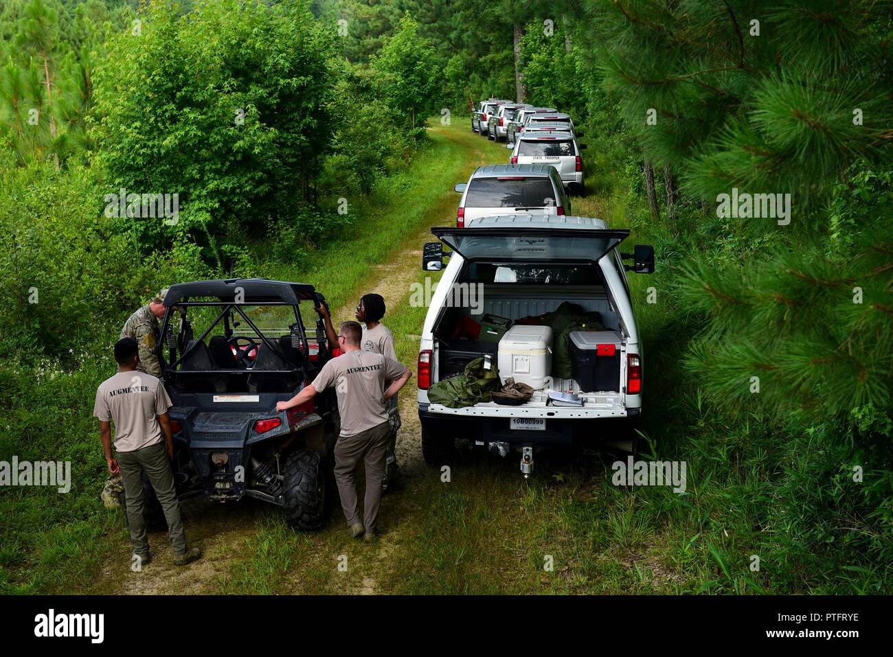 Survival, evasion, resistance and escape augmentees prepare to act as an opposing force and search for pilots and weapon systems officers from Seymour Johnson Air Force Base, North Carolina, during combat survival training, July 11, 2017, at Howell Woods, Four Oaks, North Carolina. During the training, pilots and WSOs attempted to evade the augmentees and state troopers from the NC State Highway. Stock Photo