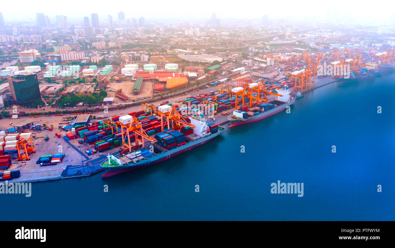 Aerial view from flying drone of shipping and freight import of goods and freight export and delivery to the international port. Water transport conce Stock Photo