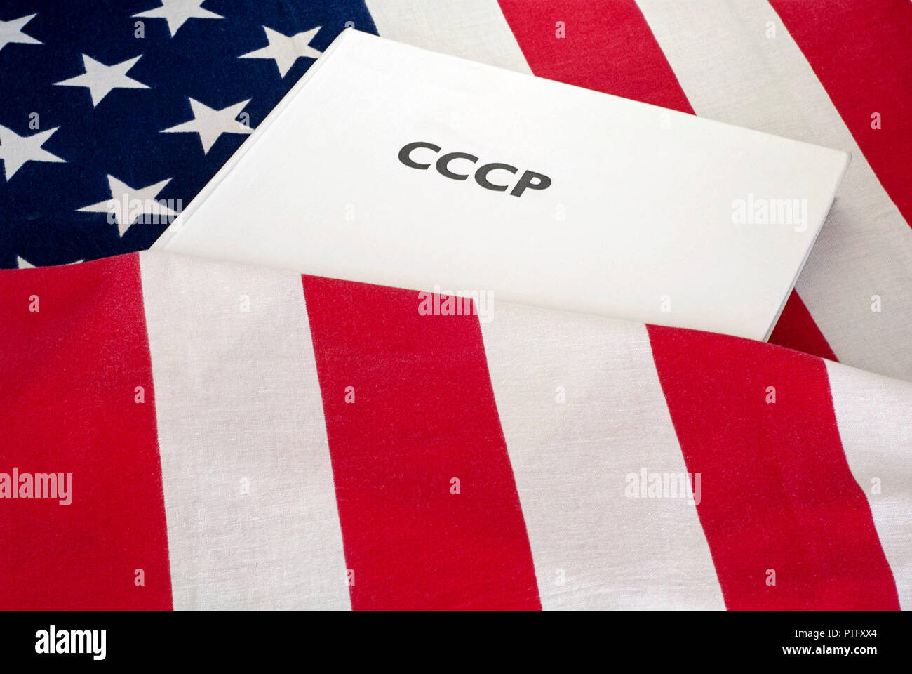 cold war  USA and USSR, CCCP written on the book, flag baground Stock Photo