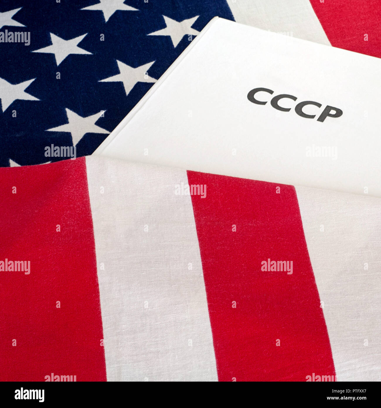 cold war  USA and USSR, CCCP written on the book, flag baground Stock Photo