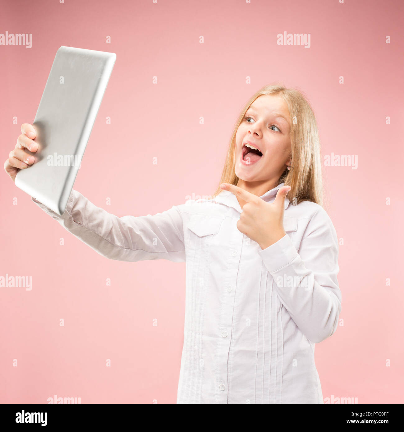 Teen girl with laptop. Love to computer concept. Attractive female half ...