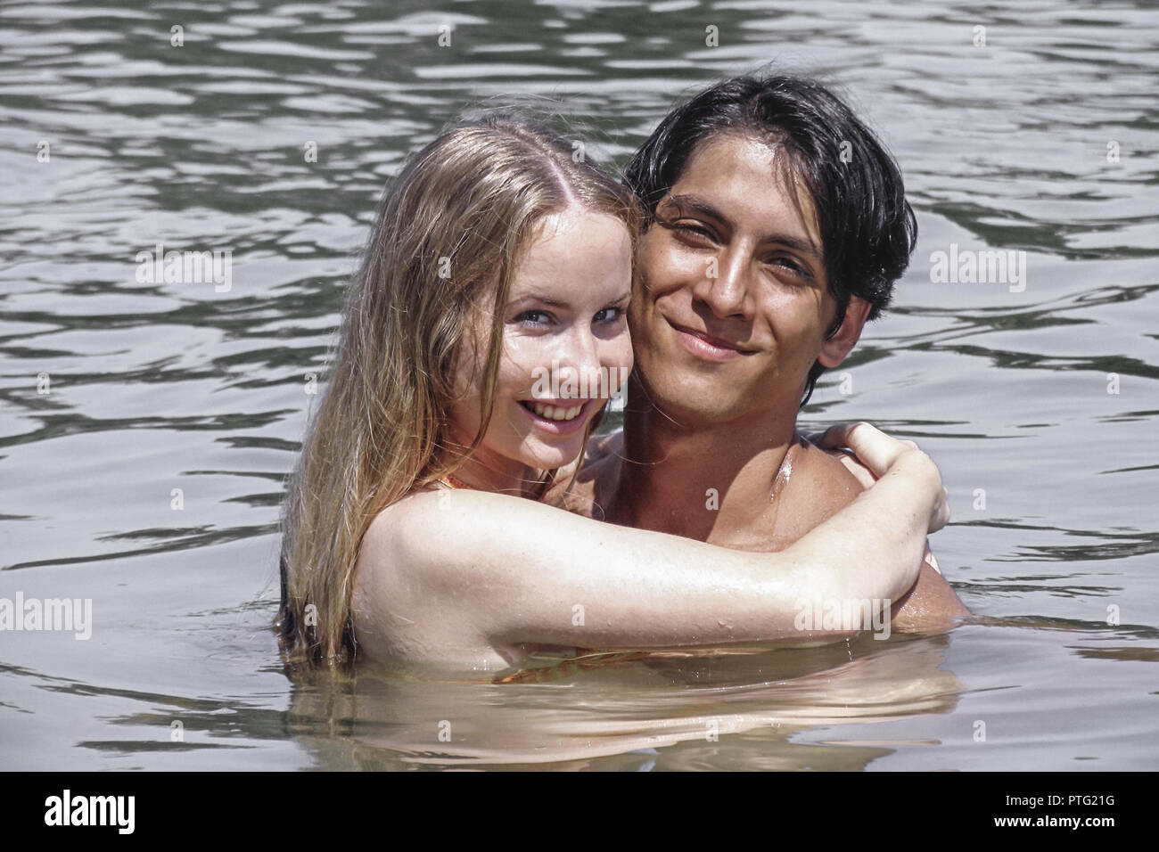 26580830 - Stock Photo - Happy couple heads flirting bathing in a transparent water on the beach on vacation. Glckliche Paar Kpfe flirten Baden am Strand - Stock Photo