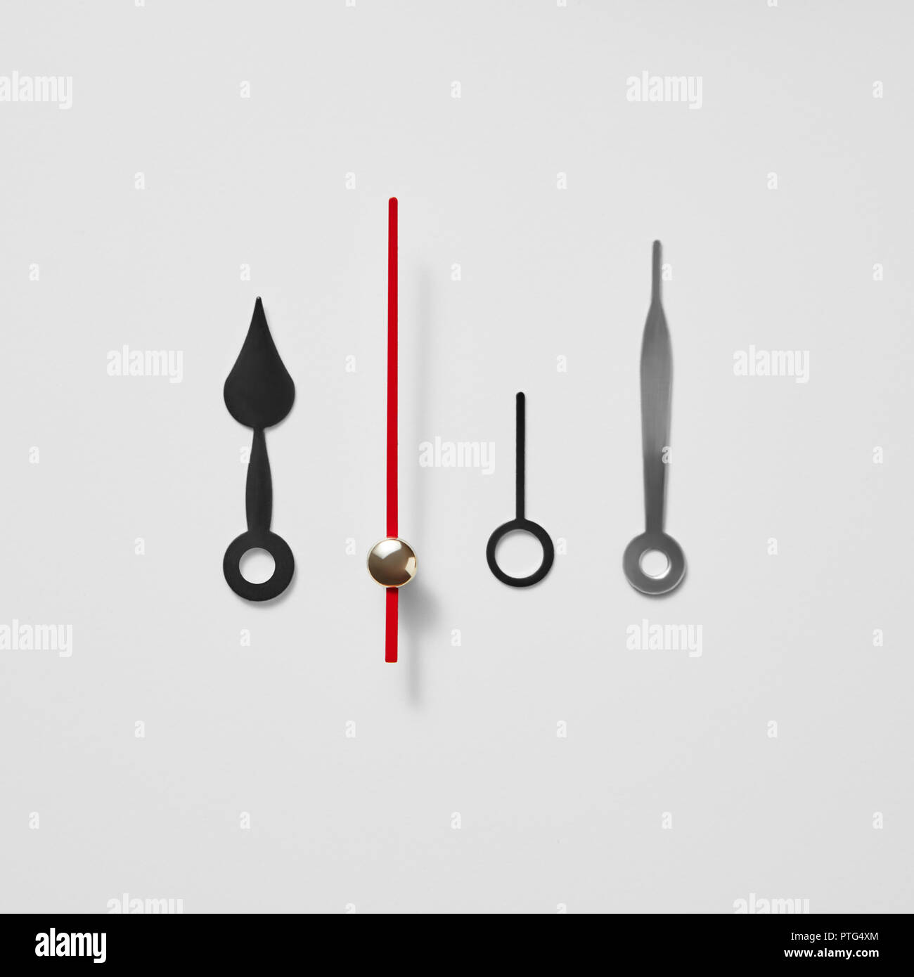 Set of mechanical clock hands on a gray background with copy space