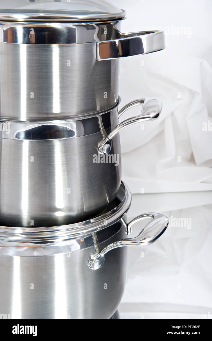 Metal pans on a light shiny background Stock Photo Alamy