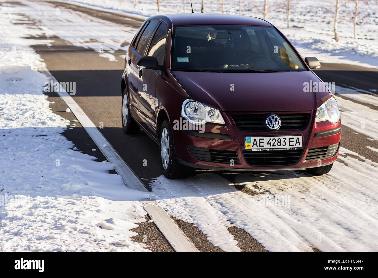 DNIPROPETROVSK REGION, UKRAINE - FEBRUARY 03, 2014: Volkswagen Polo  burgundy color on the winter road, non-urban Stock Photo - Alamy