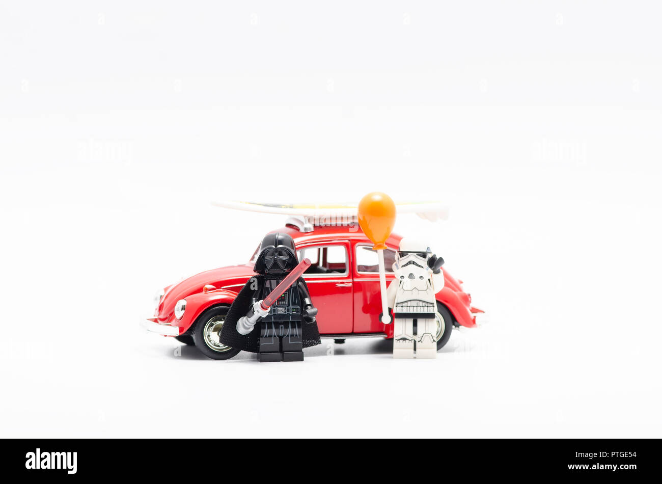Lego darth vader and storm trooper holding balloon with volkswagen. Stock Photo