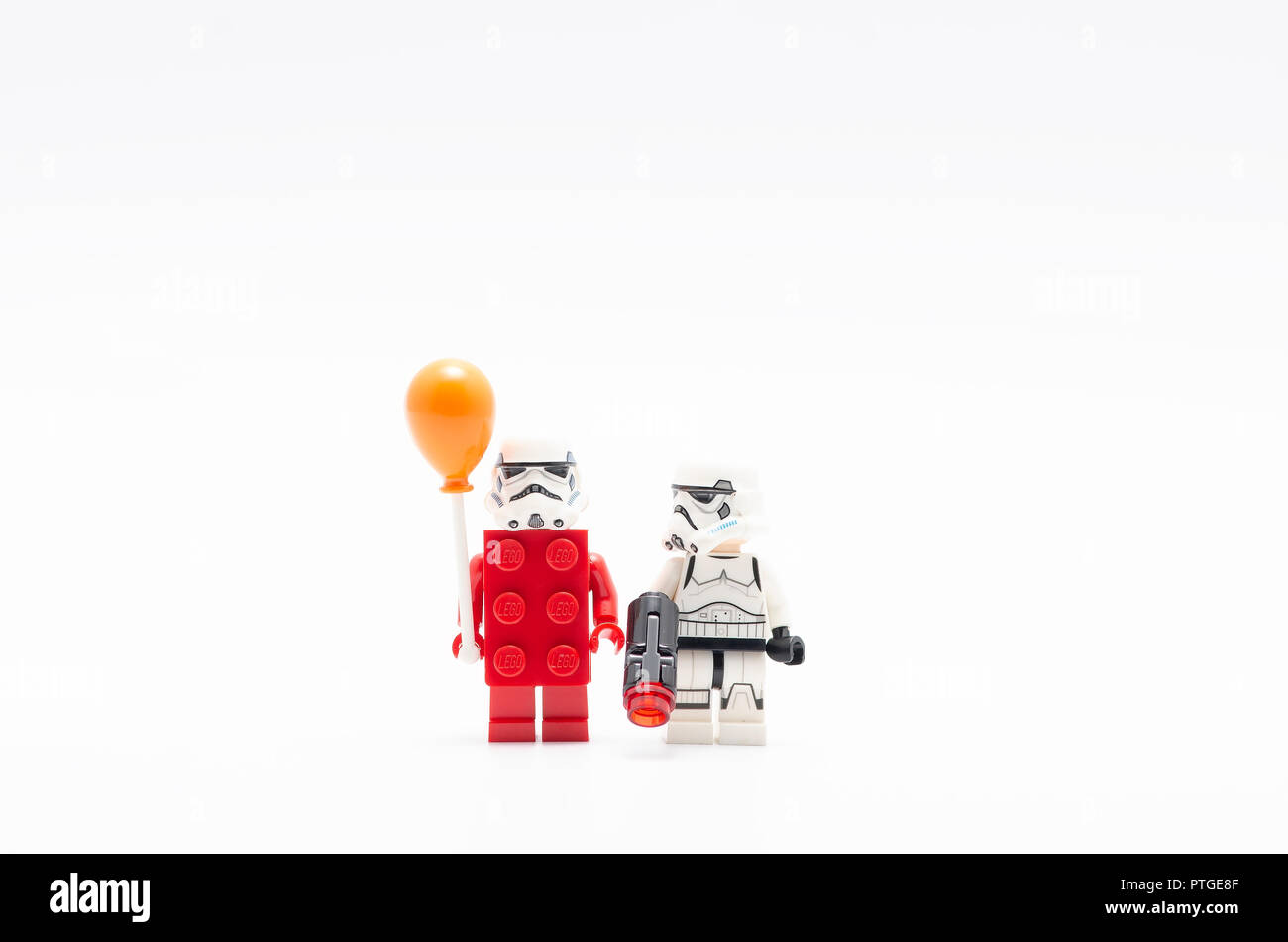 Lego storm troopers one of them holding balloon. Stock Photo