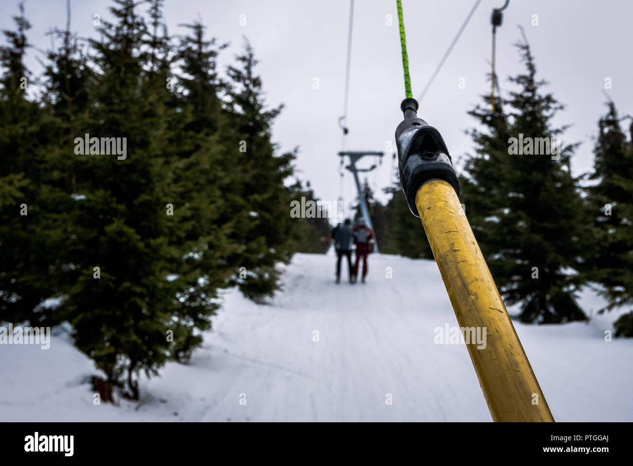 Skiers on T-bar ski lift in Szklarska Poreba, Poland. Stock Photo