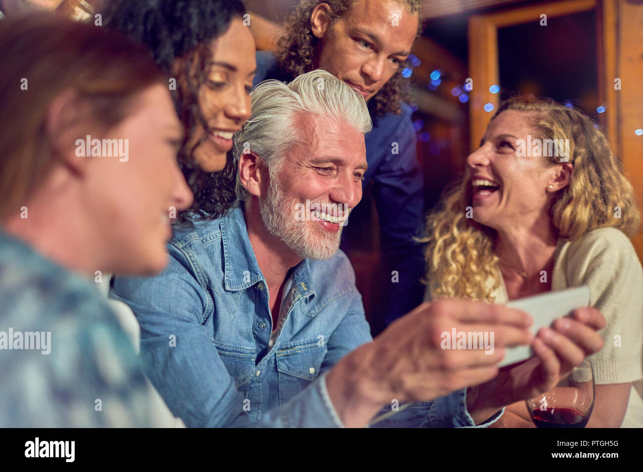 Happy friends talking laughing using hi-res stock photography and ...