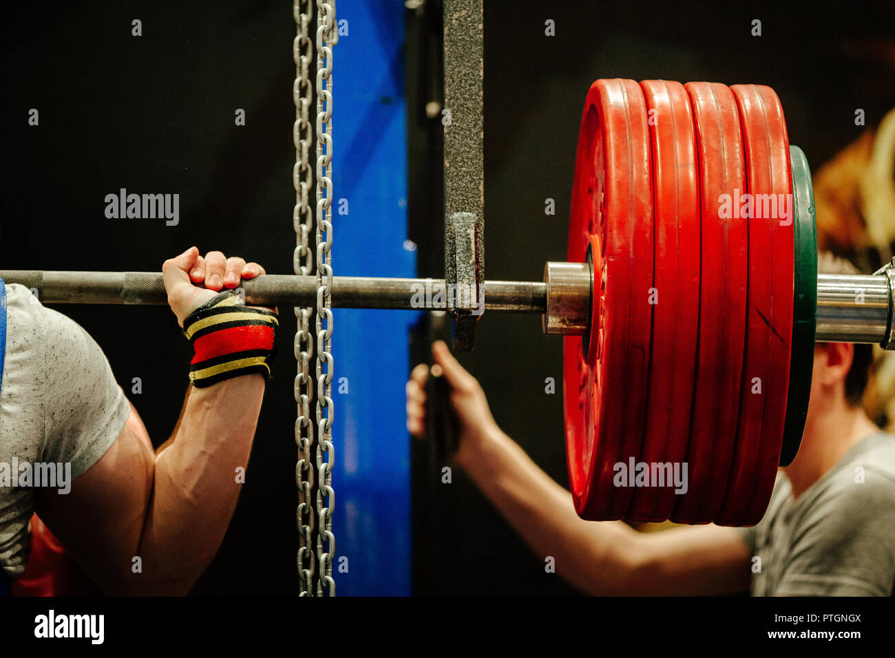 athlete squat with barbell to competition in powerlifting Stock Photo