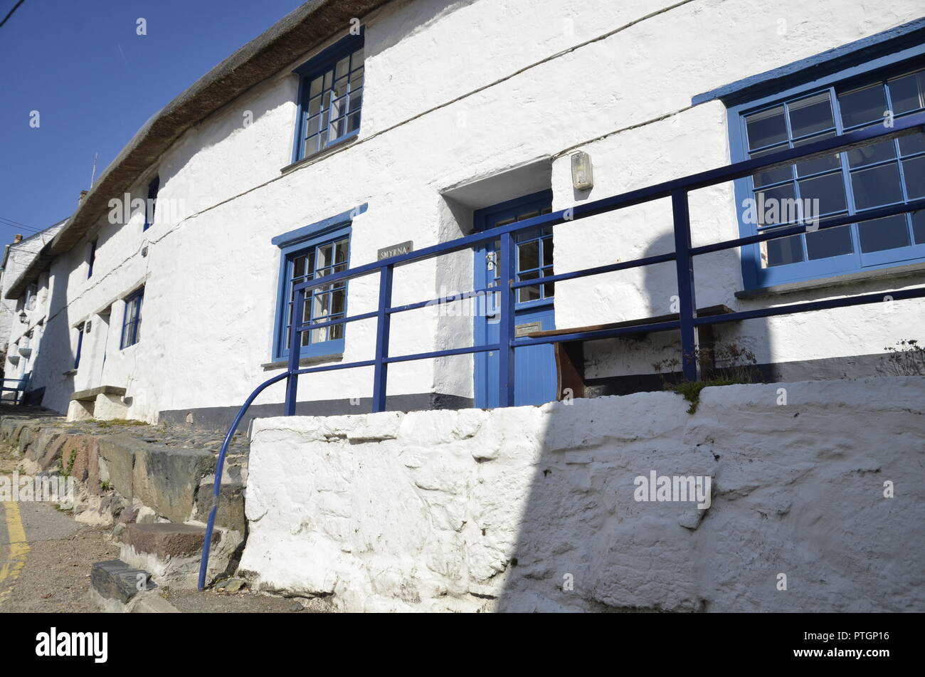 White washed cottages in the small Cornish village of Cadgwith Cove Stock Photo