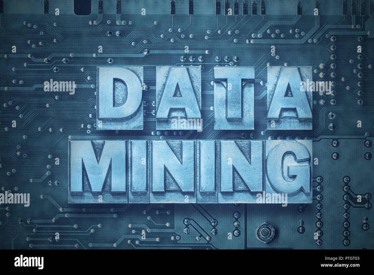 data mining phrase made from metallic letterpress blocks on the pc board background Stock Photo