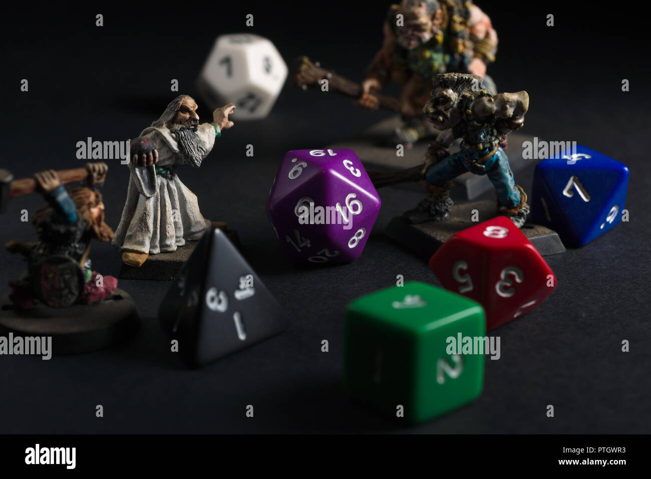 Dungeons and Dragons dice and hand painted lead figures produced by Games Workshop in 1983 as accessories to the game Stock Photo