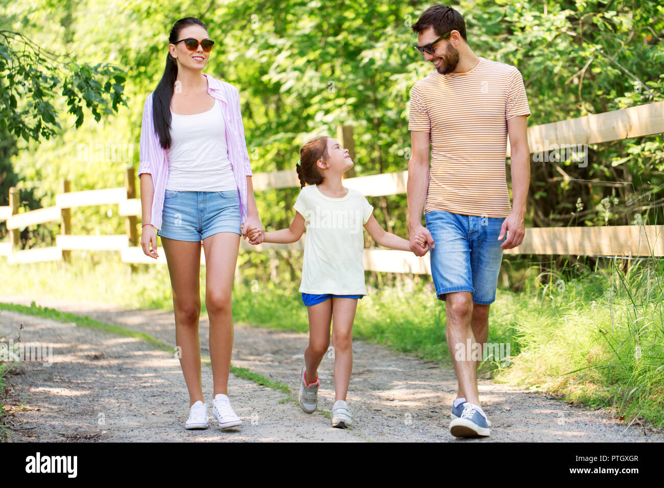 happy family walking in summer park Stock Photo - Alamy