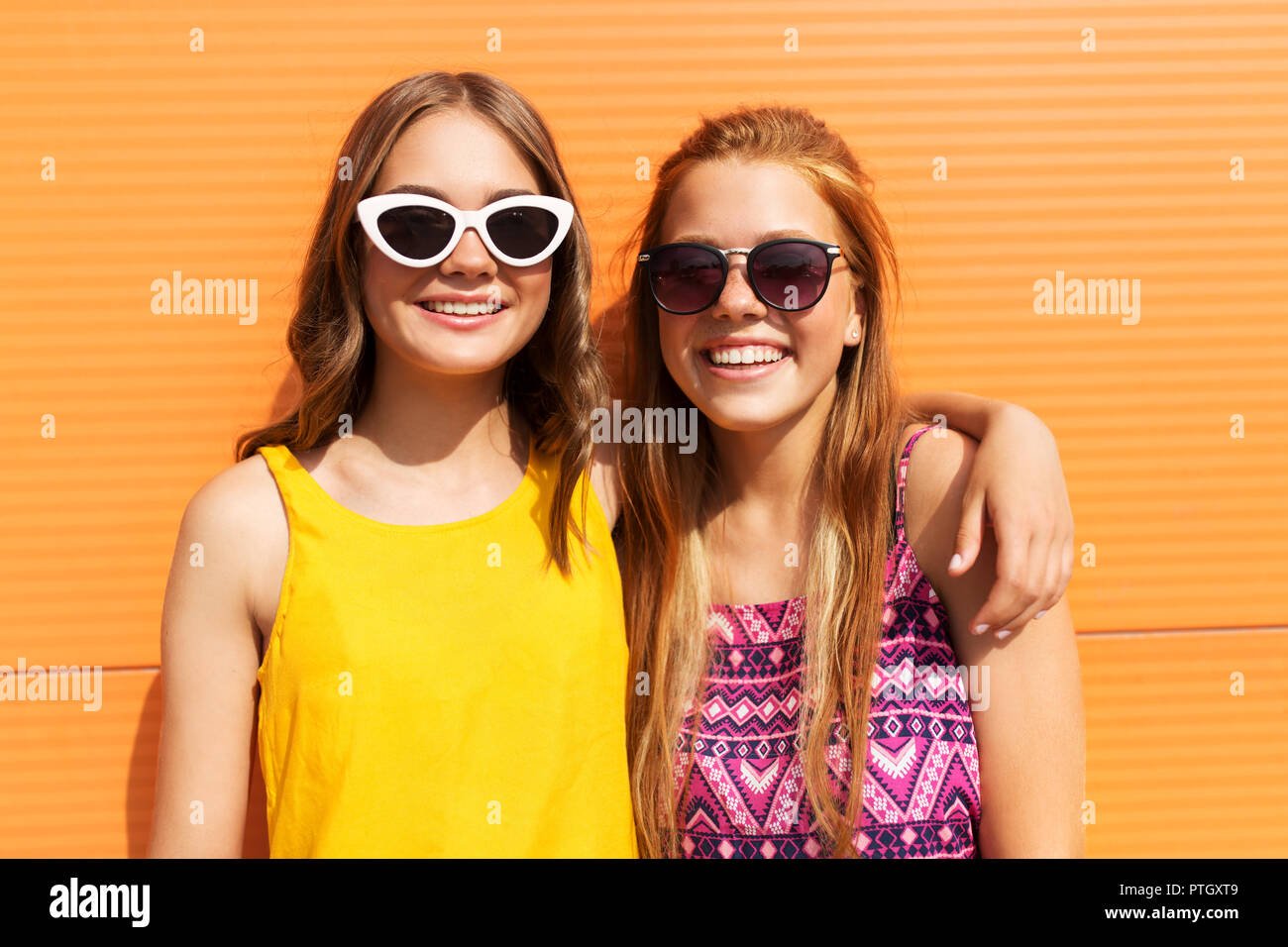 teenage girls in summer clothes hugging outdoors Stock Photo - Alamy