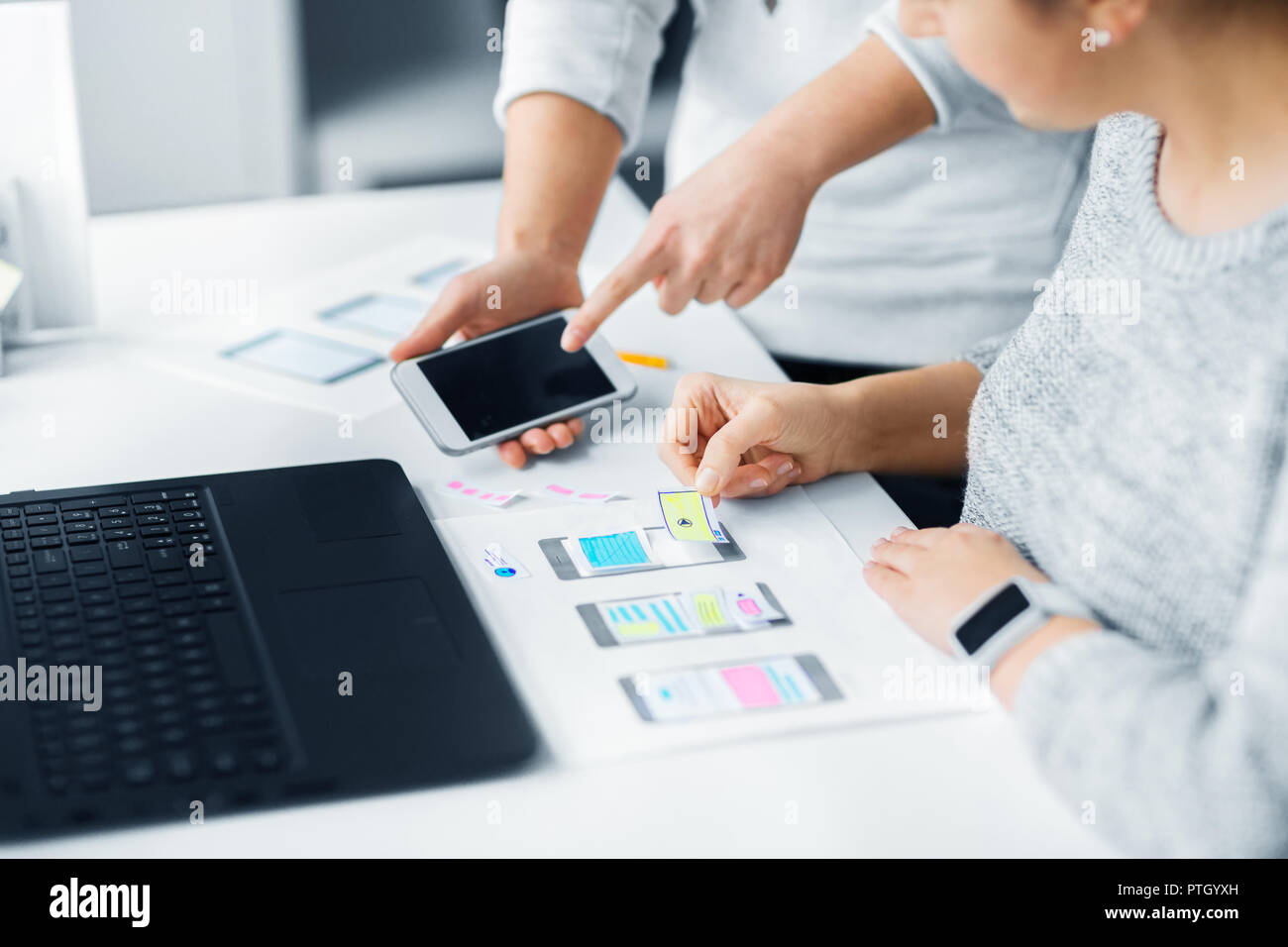 web designers creating mobile user interface Stock Photo