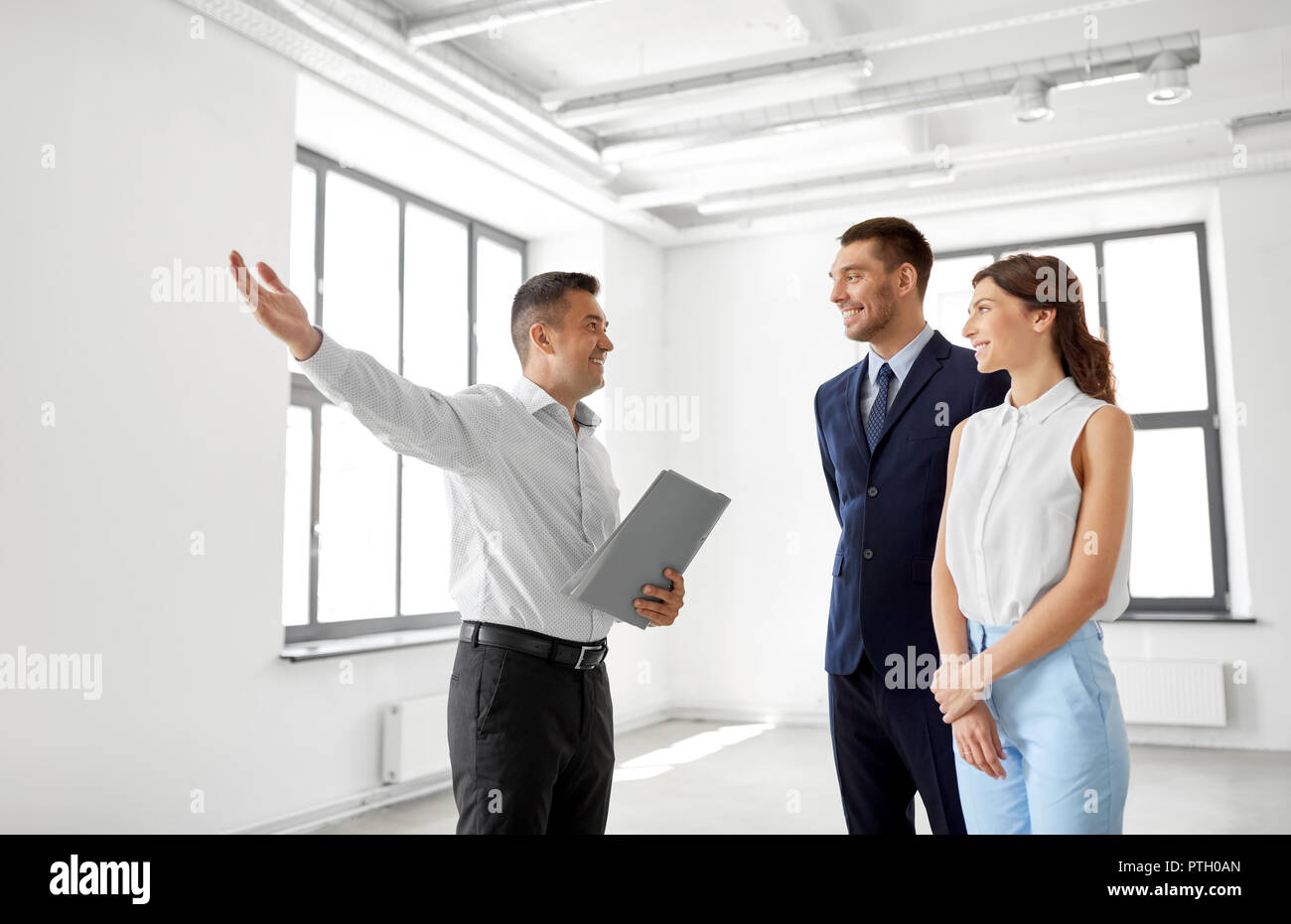 realtor showing new office room to customers Stock Photo Alamy