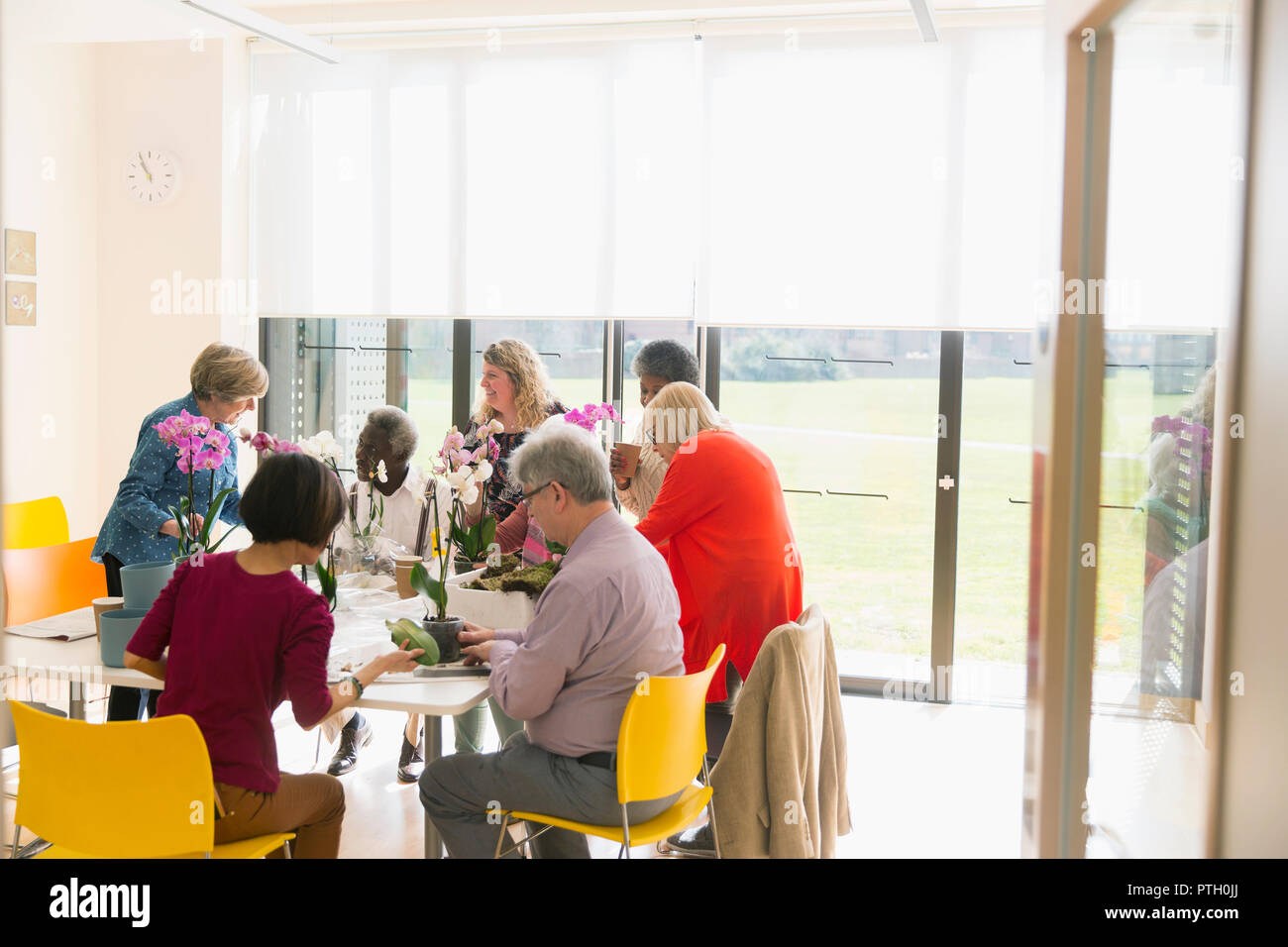 Active seniors enjoying flower arranging class Stock Photo