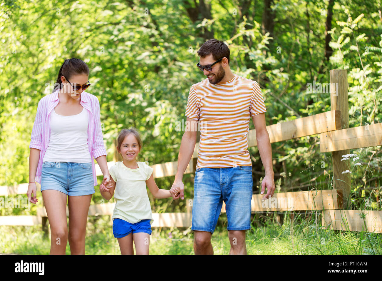 happy family walking in summer park Stock Photo - Alamy