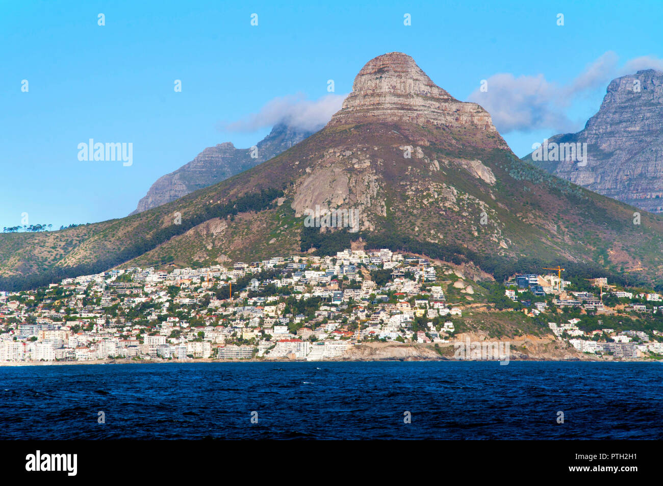 Cape Town, South Africa May 10, 2016: Cape Town and coast line, jetty. Far mountain on the blue sky background. Summer. South Africa Stock Photo