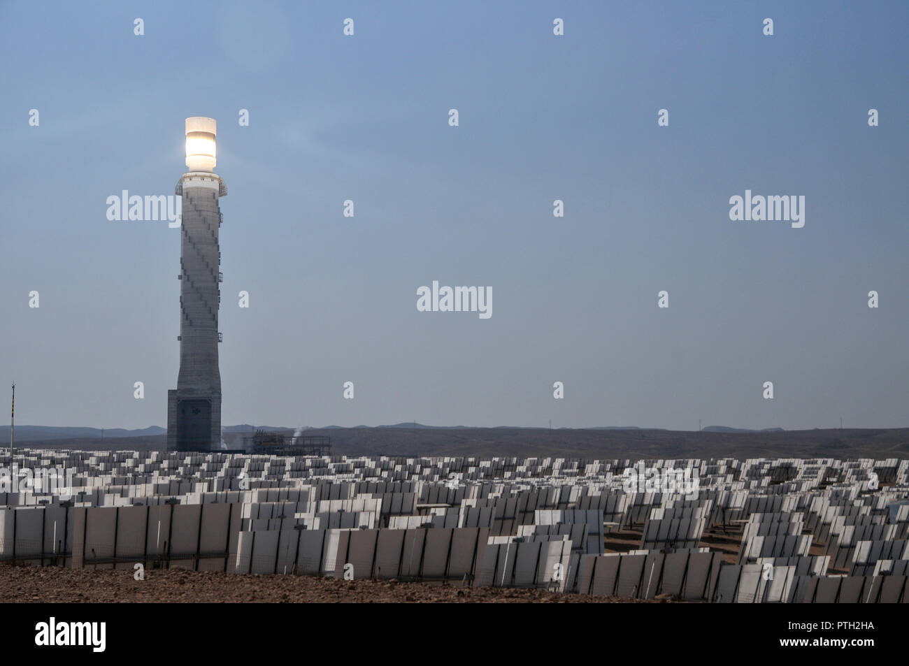 The Ashalim Solar Power station is a solar thermal power station in the Negev desert near the kibbutz of Ashalim, in Israel. The station will provide  Stock Photo