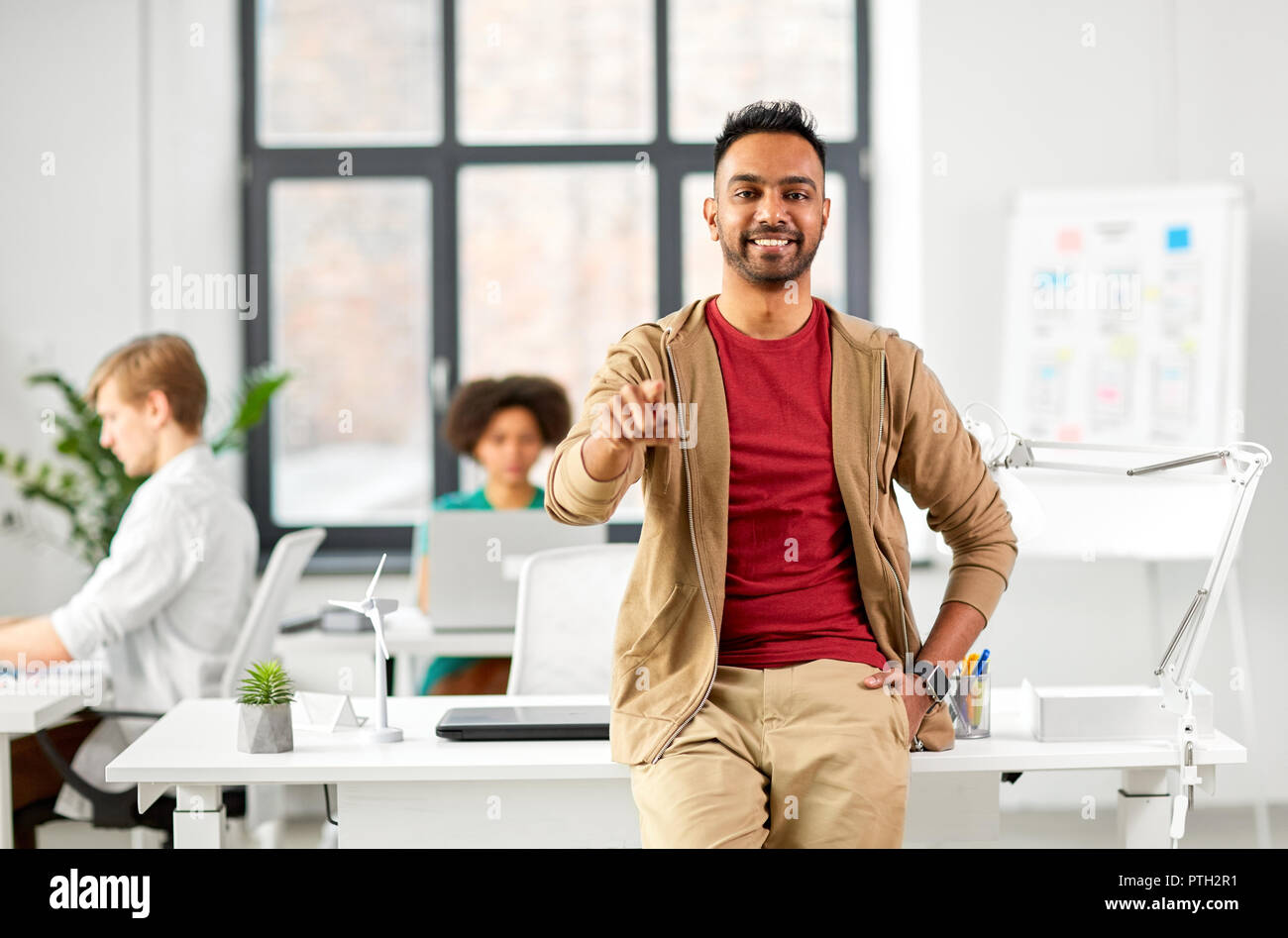 creative man at office pointing finger at you Stock Photo - Alamy