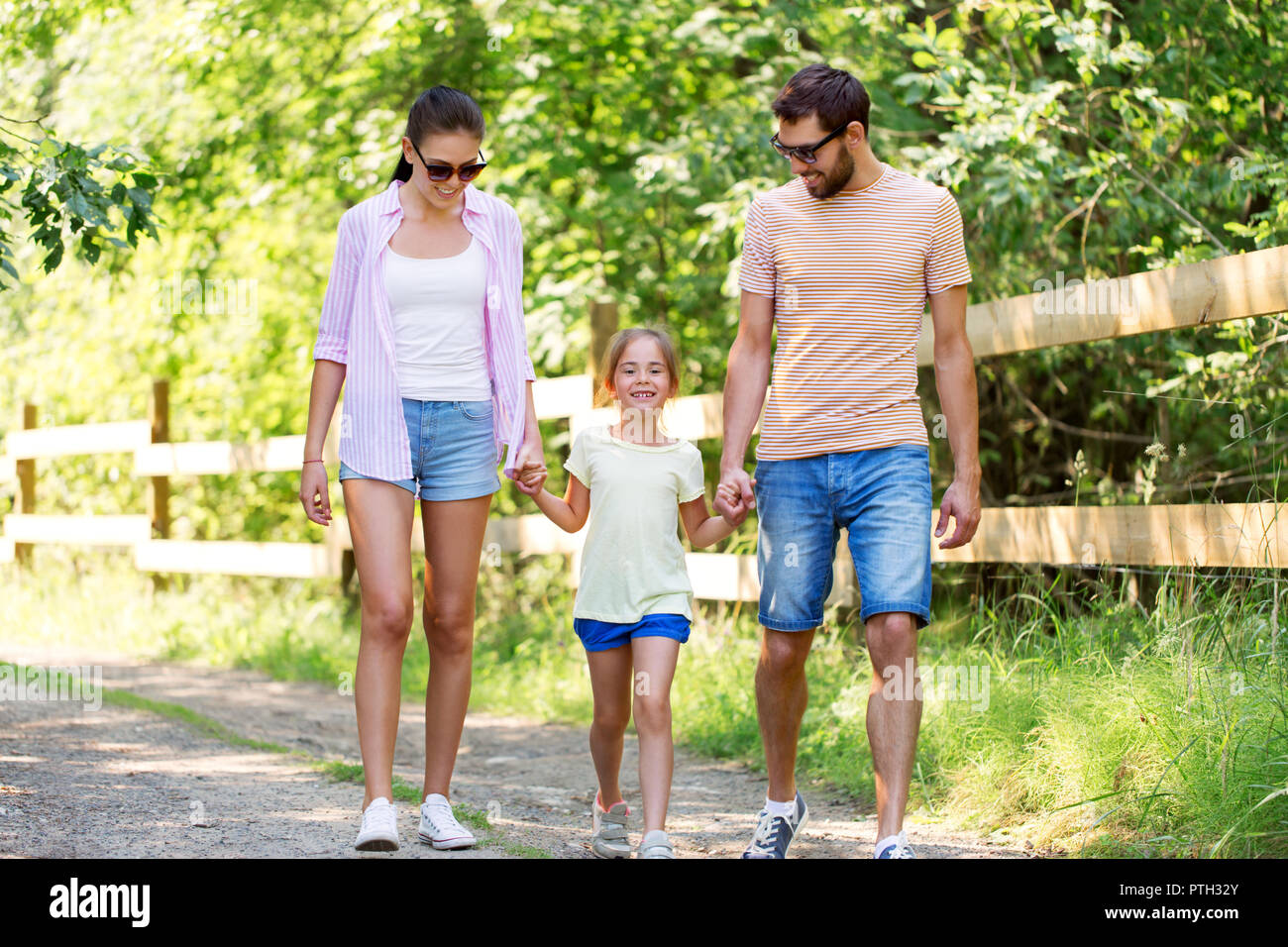 happy family walking in summer park Stock Photo - Alamy