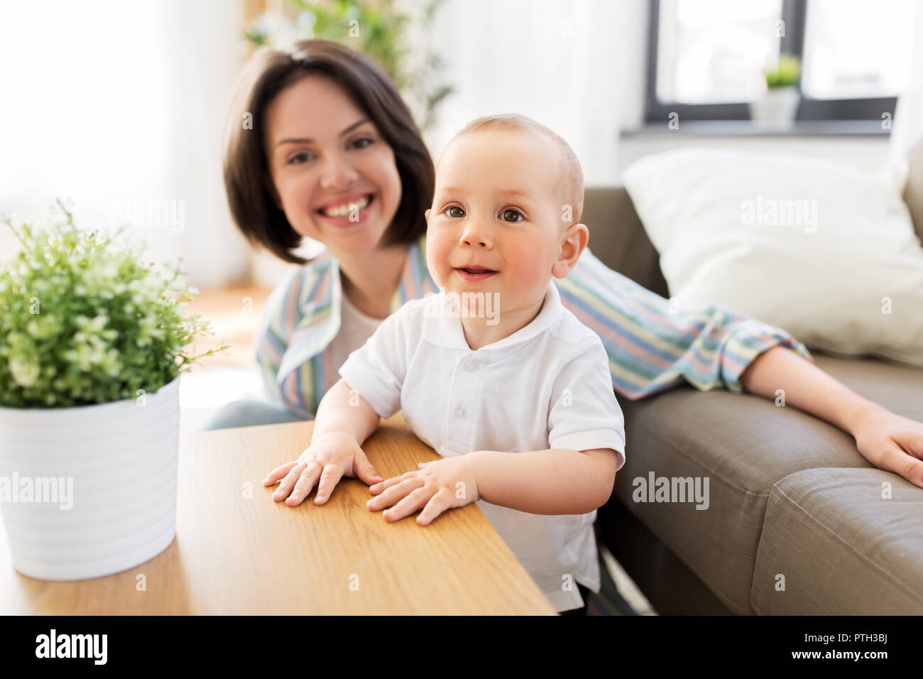 happy little baby boy with mother at home Stock Photo Alamy