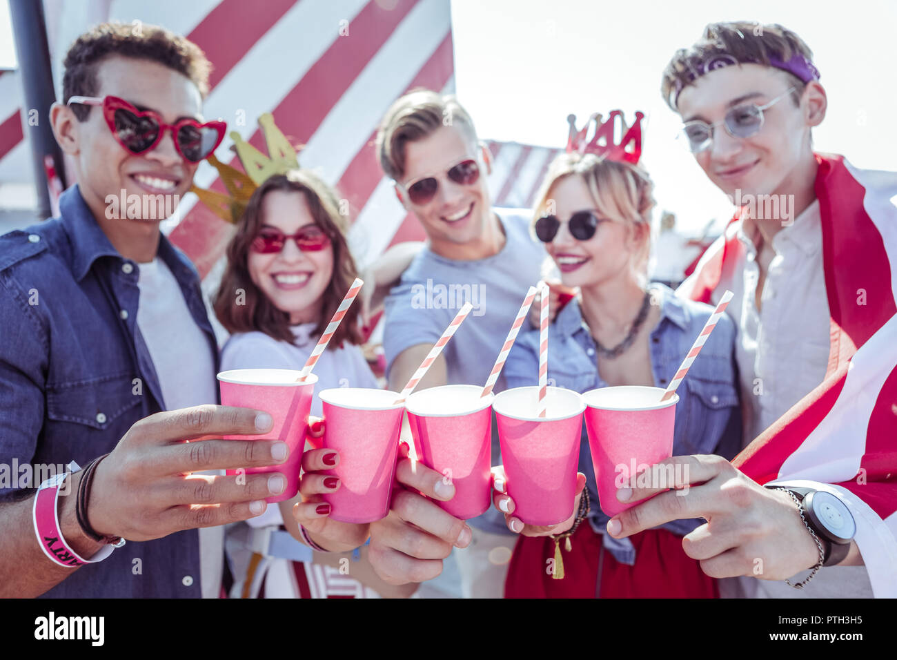Cheerful mulatto man visiting party with friends Stock Photo