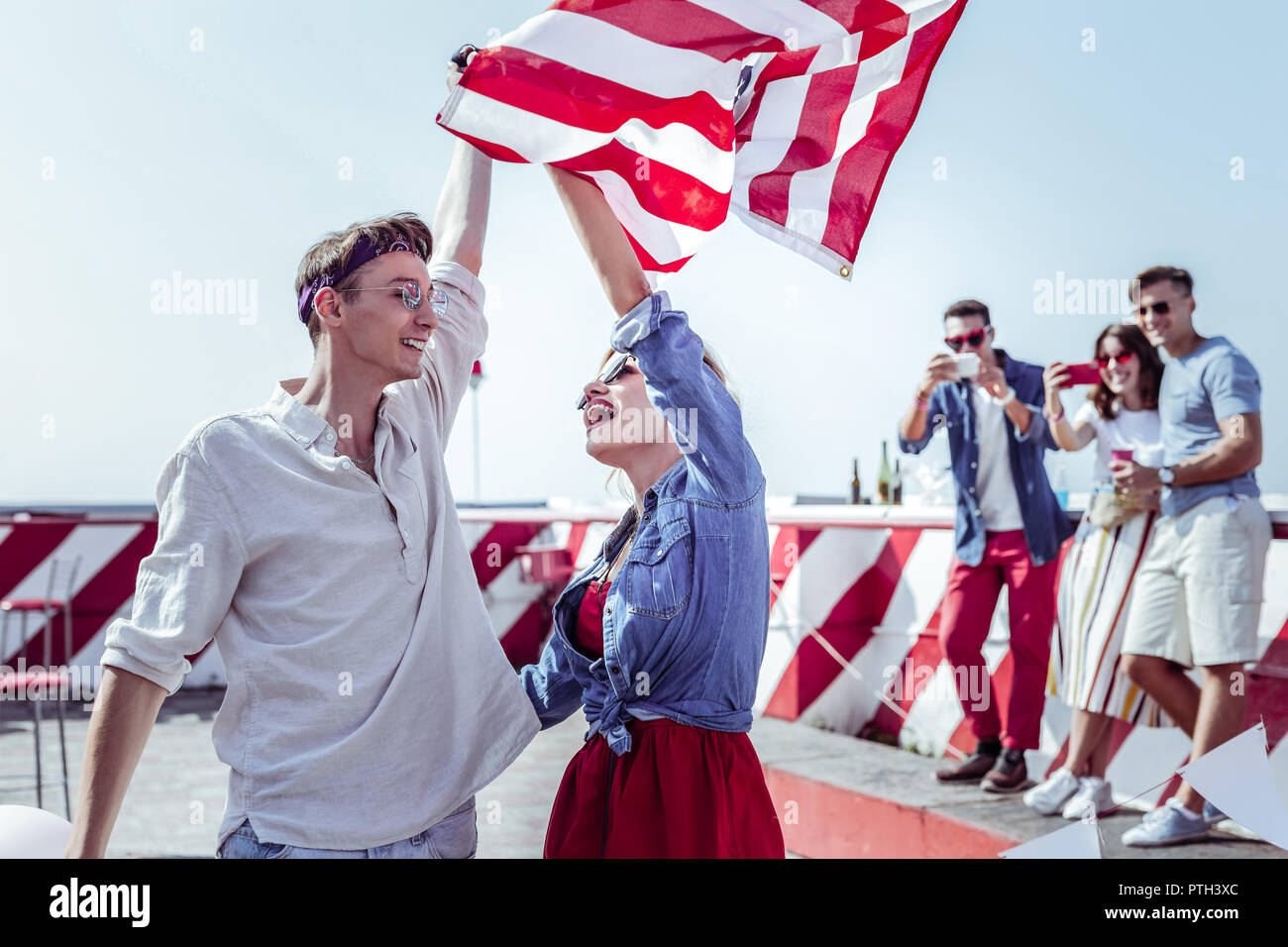 Joyful young people looking at each other Stock Photo