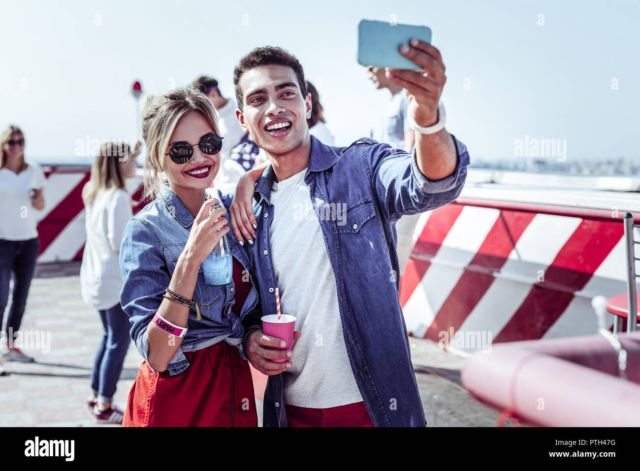 Pleased group mates doing selfie picture on camera Stock Photo