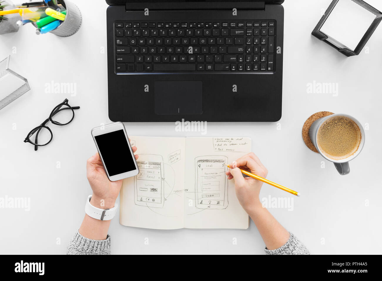 web designer working on smartphone user interface Stock Photo
