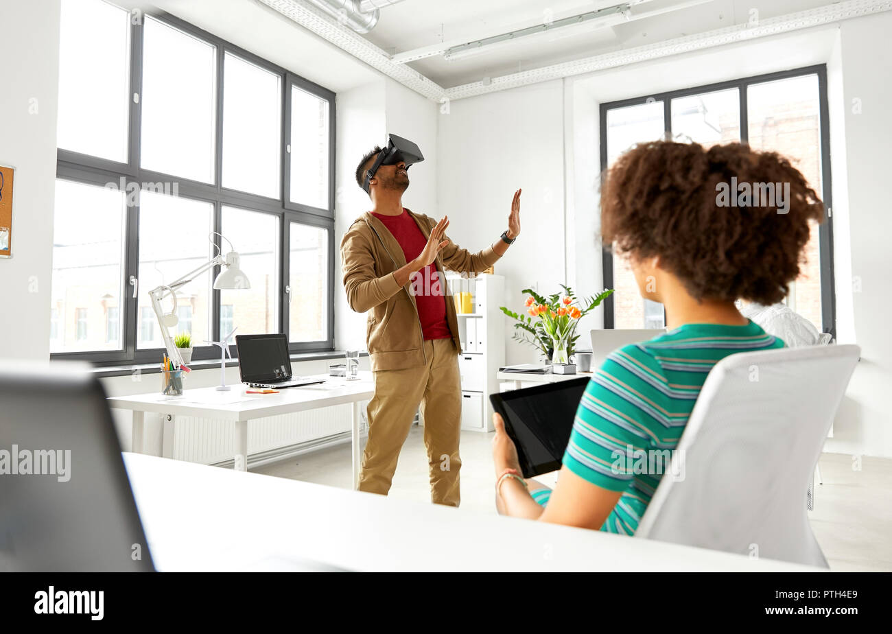 developers with virtual reality headset at office Stock Photo