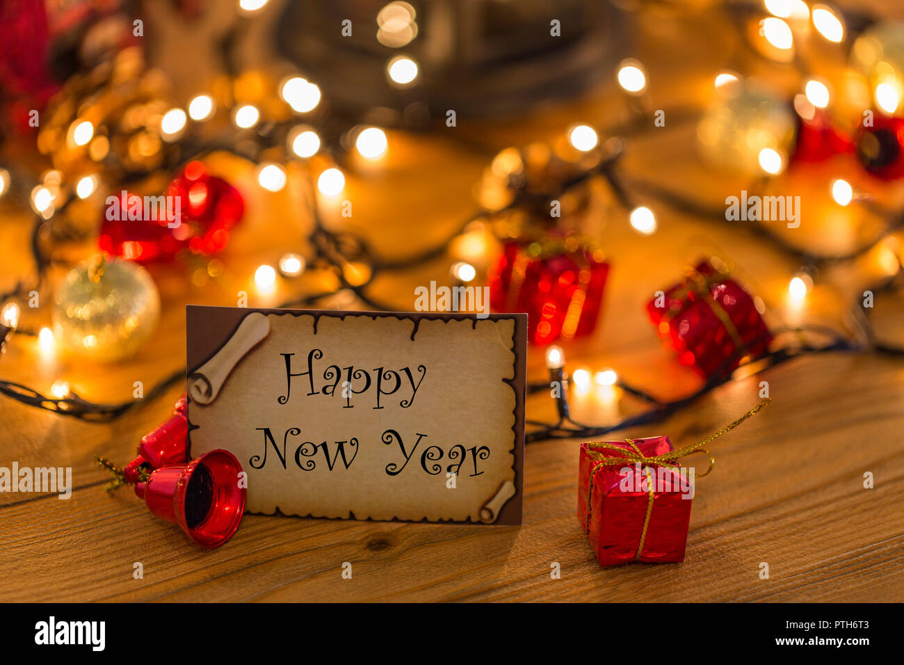 Greeting card for happy new year with christmas decors, lights and lantern Stock Photo