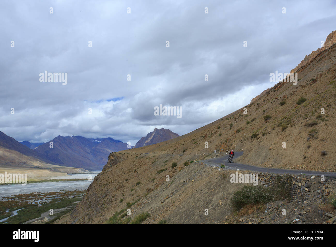 A biker riding motor bike in Spiti Valley, India Stock Photo